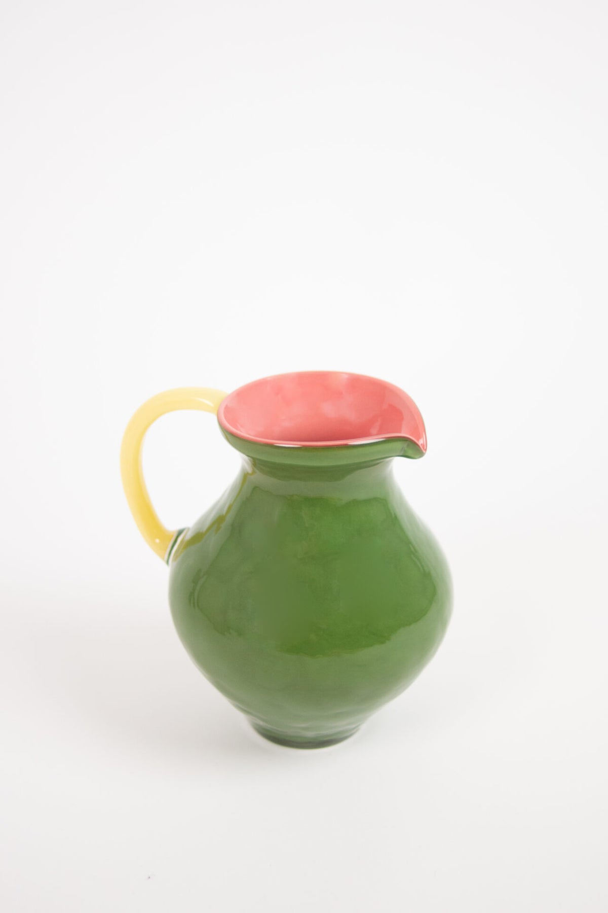 Kiko green glass jug with a pink inside and yellow handle by Olsson & Jensen