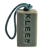 Grey-green Back to Life exfoliating soap by KLEEN embossed with the KLEEN logo, hanging from its rope