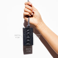 Hand holding the KLEEN Blue Velvet soap bar with dimensions marked to show its size