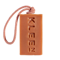 KLEEN Good Vibrations pink clay soap bar hanging from its cotton rope