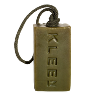 Olive green KLEEN Morning Glory soap bar hanging from its cotton rope against a black background