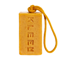 Yellow Mellow turmeric soap on a rope by KLEEN, a yellow bar with exfoliating flecks hanging from a yellow cotton rope