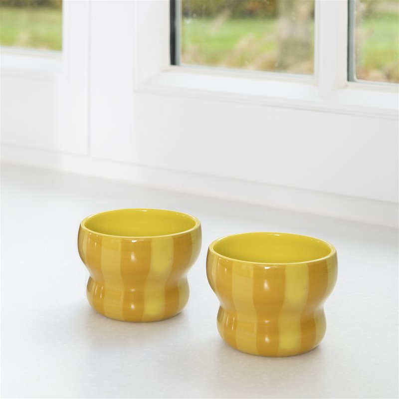 &klevering circus mugs in large yellow with hand-painted stripes on a bright windowsill
