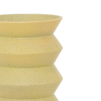 Close-up of the stacked zigzag ridges on the pale lime Kova vase