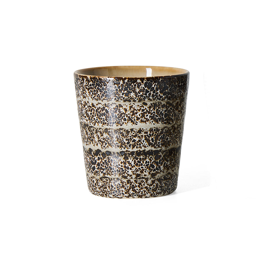 An hklvig 70s ceramic Brew coffee cup with a textured, speckled glaze in dark brown, black, and beige, featuring horizontal bands, shown on a plain white background.