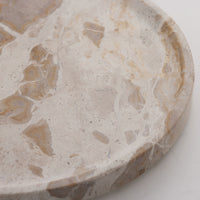 Close-up of the beige and caramel marble veining on the Ellia tray