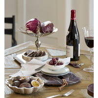 Burgundy Marnine marble board on a dining table with red wine, radicchio and serving bowls