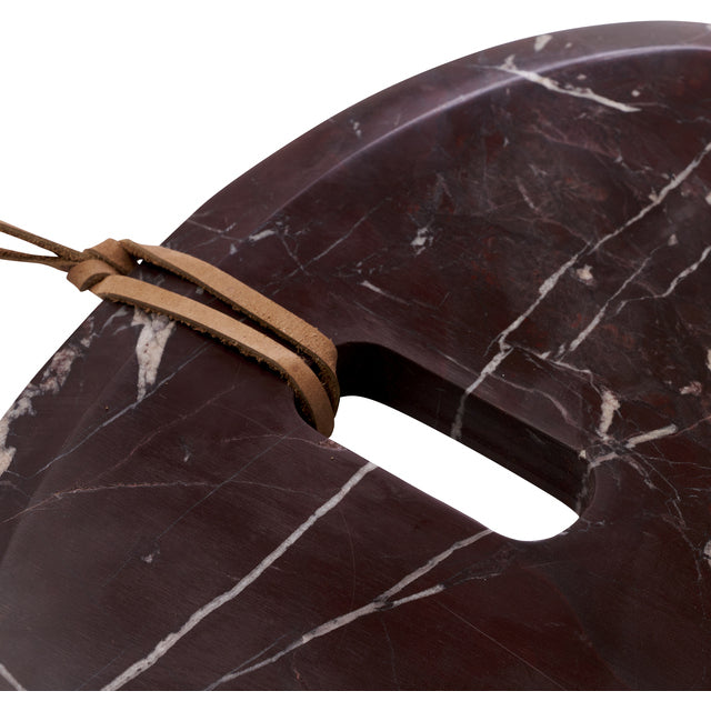 Detail of the burgundy marble veining and leather loop on the Marnine serving board handle