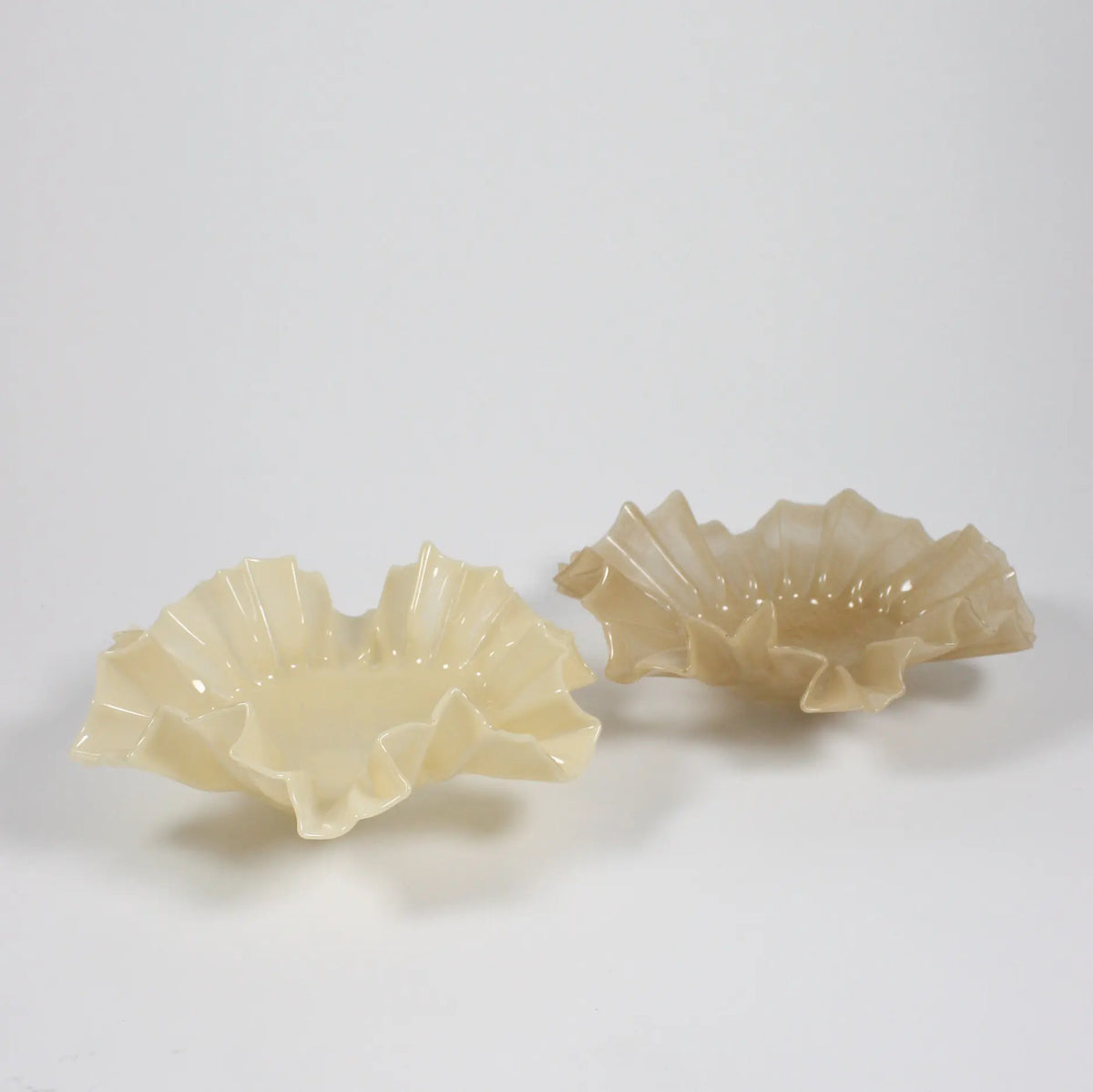 Two large Loa ruffled glass bowls in vanilla and beige by Olsson & Jensen