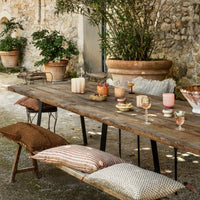 Olsson & Jensen tableware including Lolo holders on an outdoor dining table