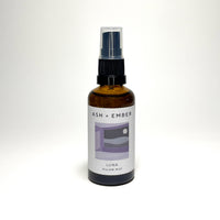 Luna Pillow Mist by Ash + Ember in amber glass bottle with lavender and clary sage scent