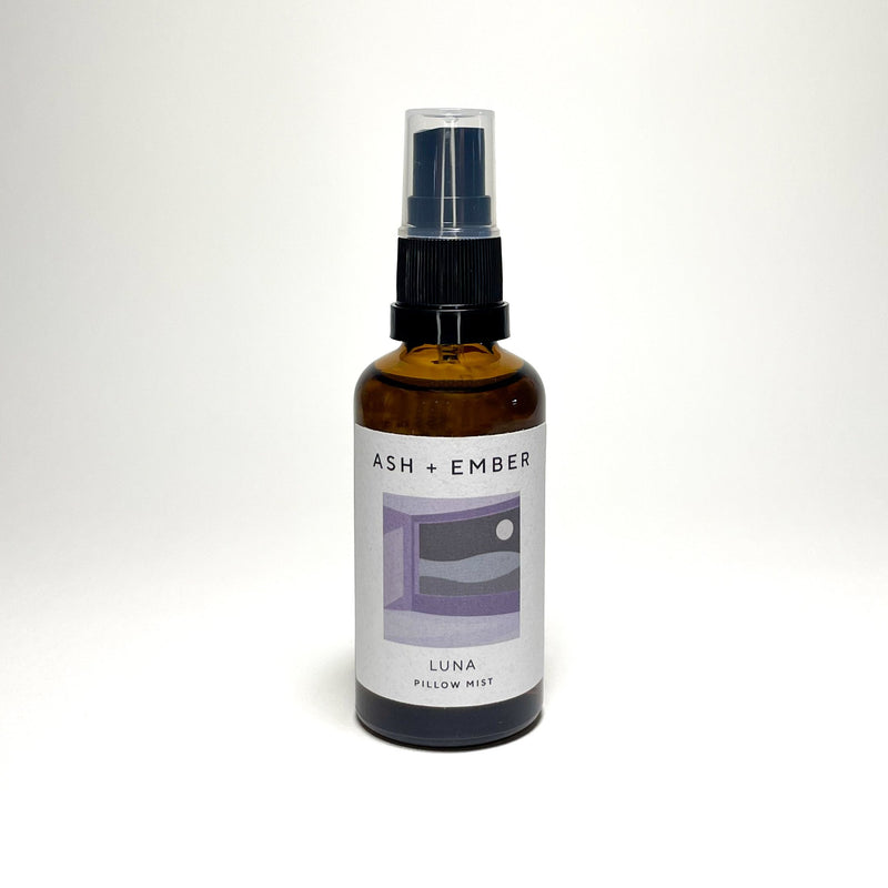 Luna Pillow Mist by Ash + Ember in amber glass bottle with lavender and clary sage scent