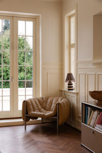 Magret rattan bowl by Olsson & Jensen in a living room with a lamp