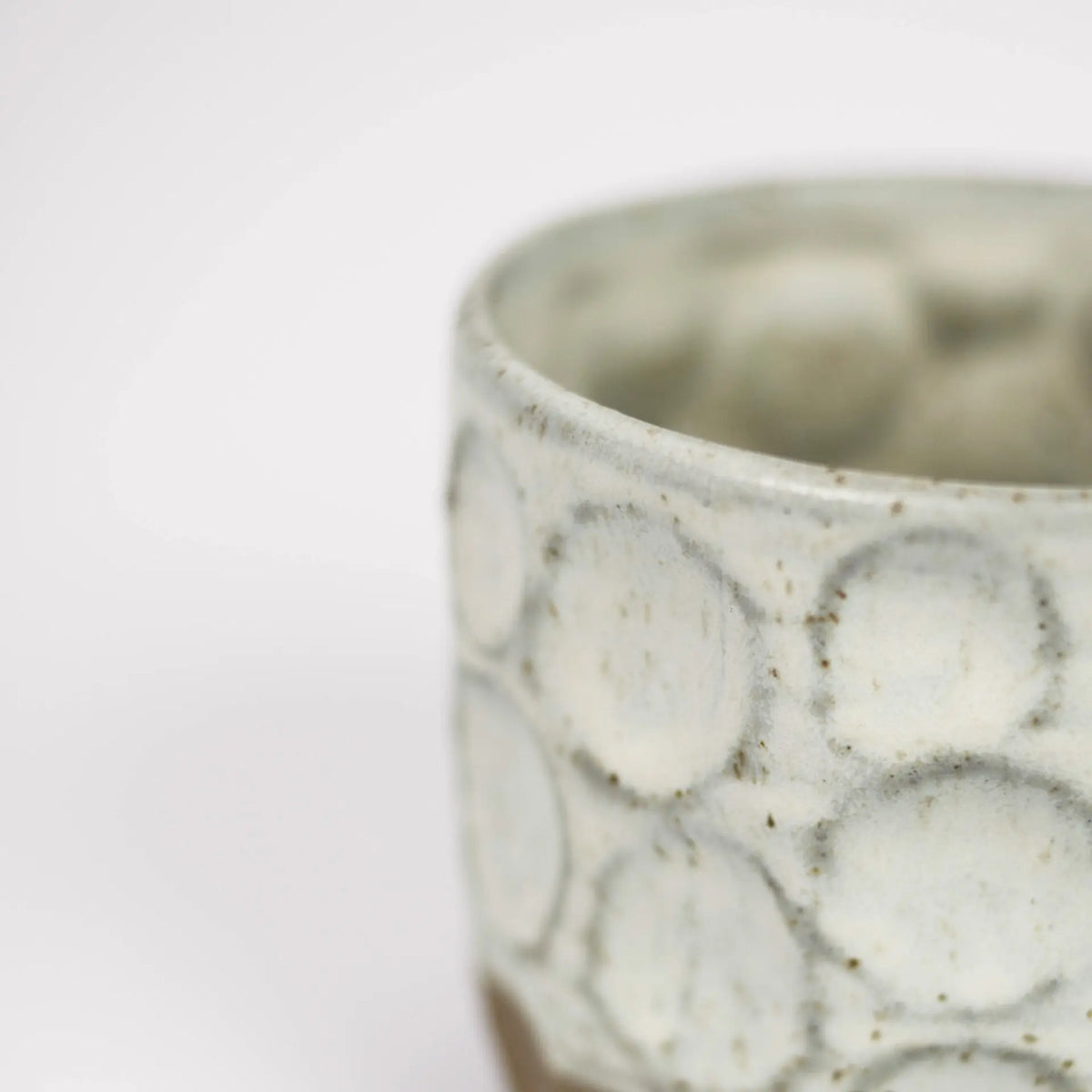 Close-up of the carved pattern on the white Maja mug by Olsson & Jensen