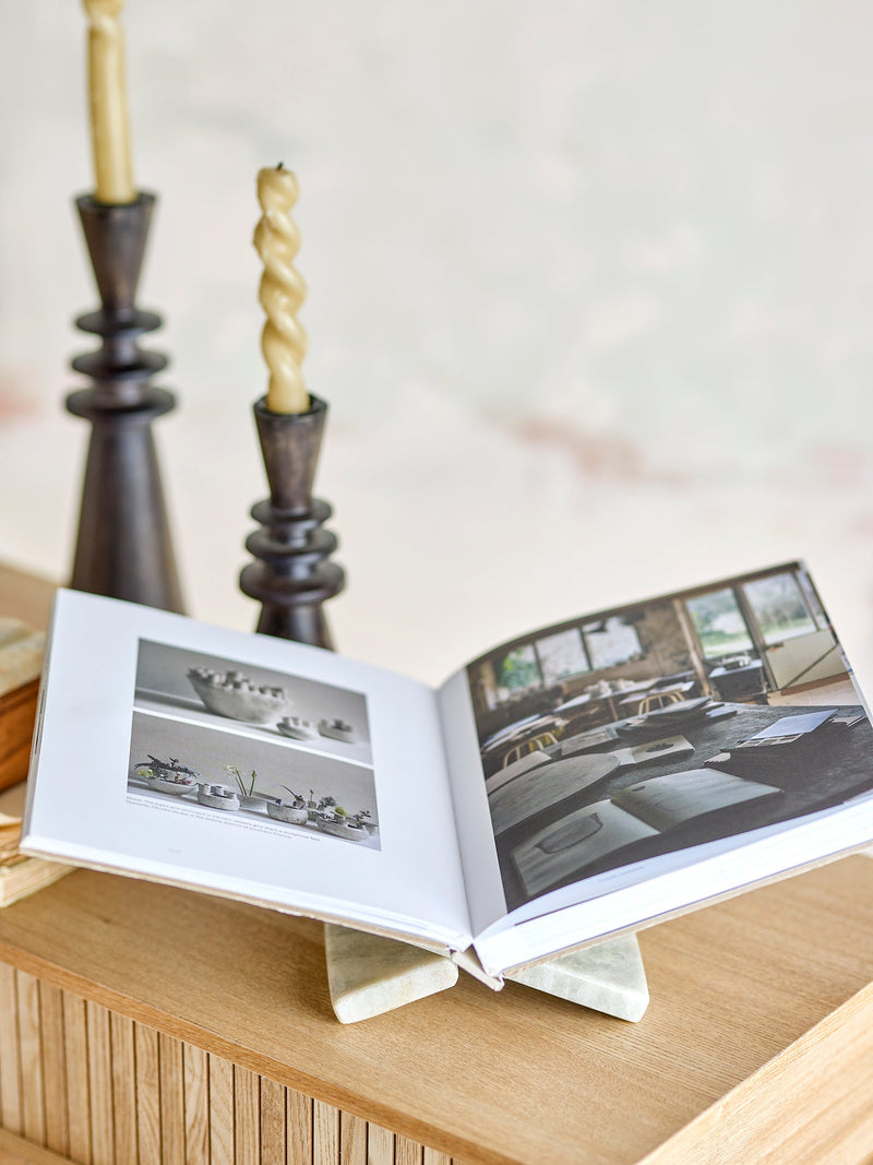 Polished natural marble magazine holder by Bloomingville on oak surface