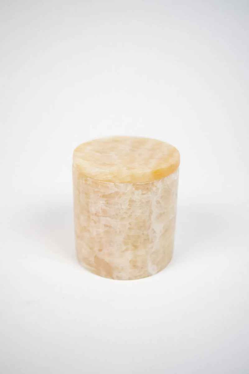 Mauro cashmere candle in a beige marble holder by Olsson & Jensen