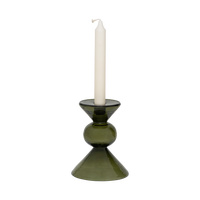 Mesi bottle green glass candle holder with an ivory dinner candle