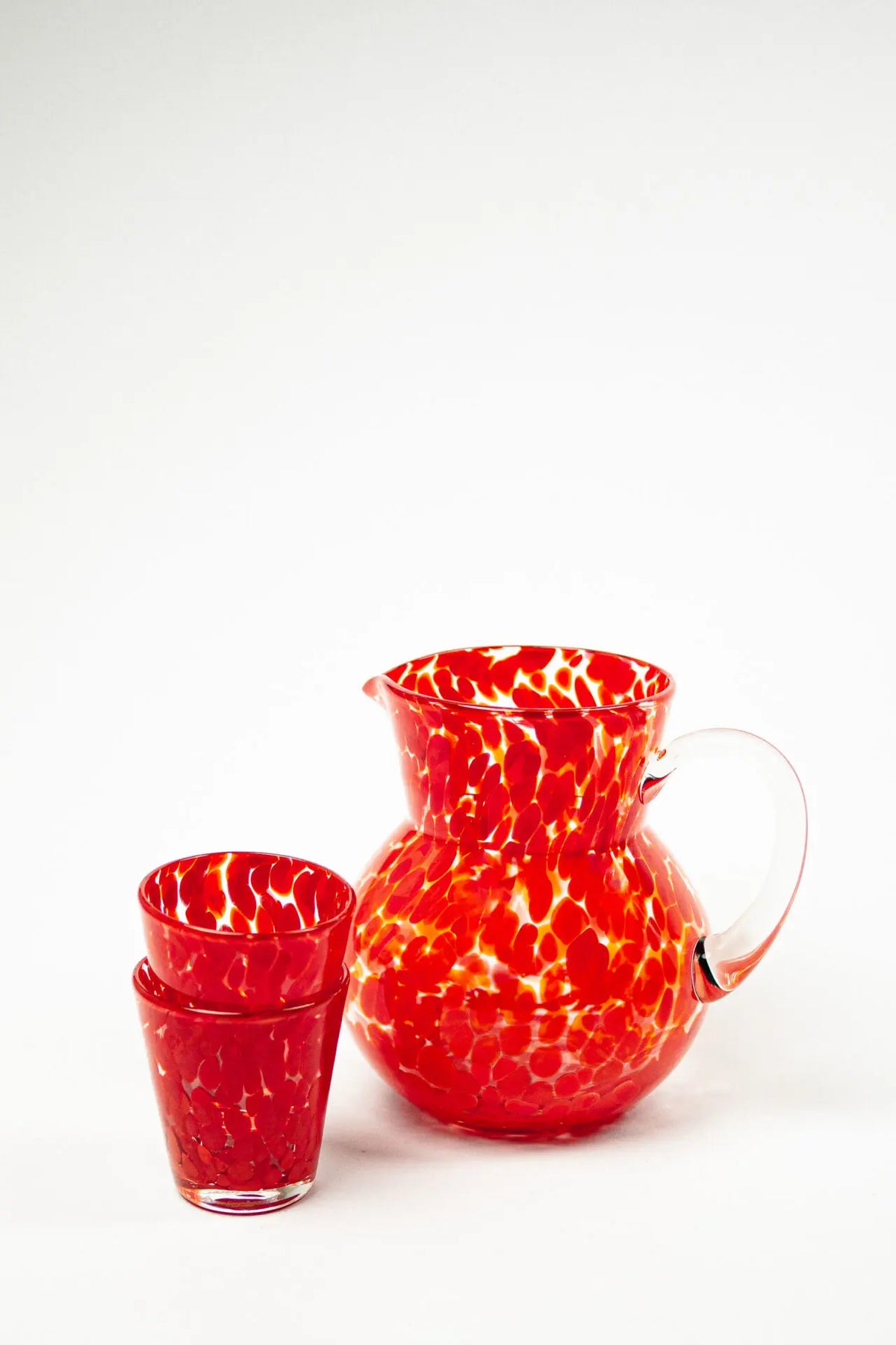 Milano red speckled glasses and matching glass jug by Olsson & Jensen