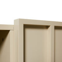 Close-up of a beige cabinet corner with a white background