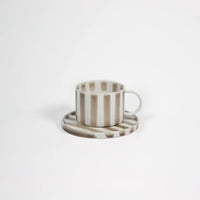 Monica beige striped stoneware cup and saucer by Olsson & Jensen
