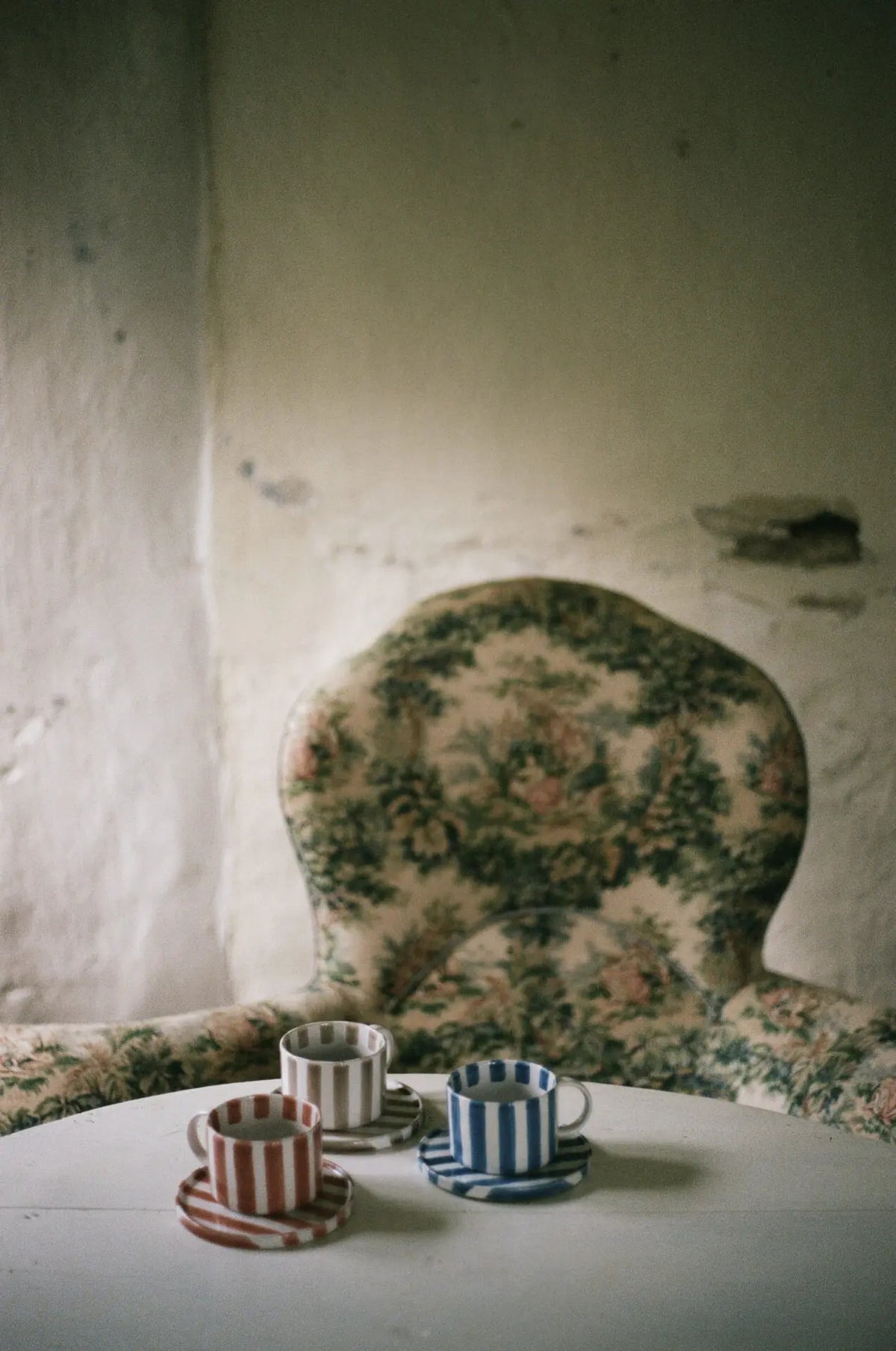 Monica striped cups by Olsson & Jensen styled on a table in a rustic room