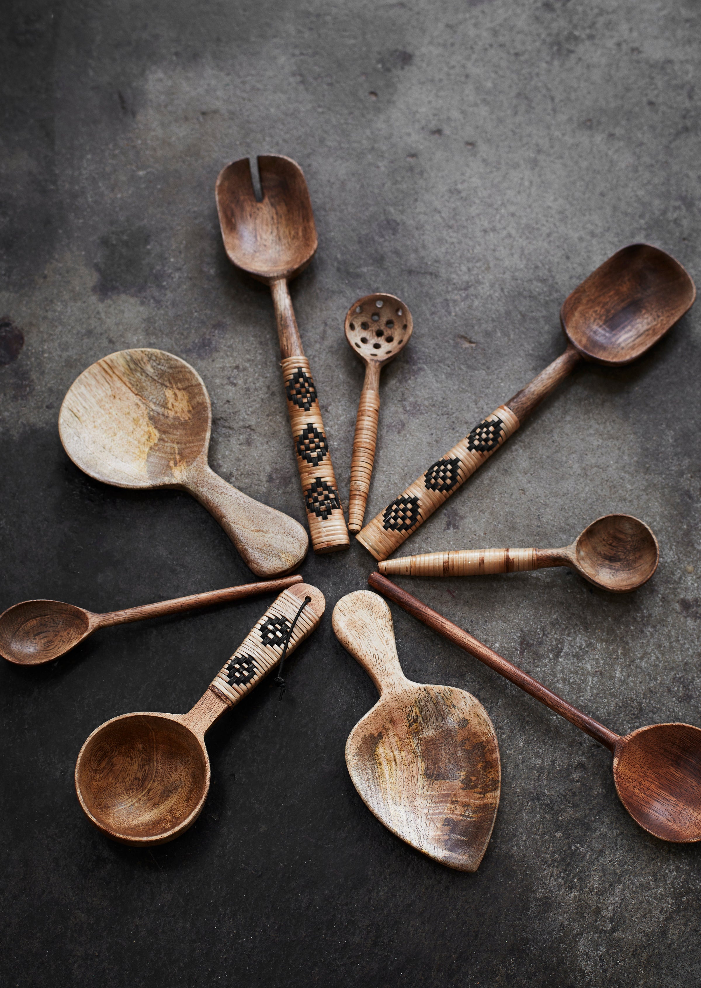 hand-carved mango wood spoon with narrow handle
