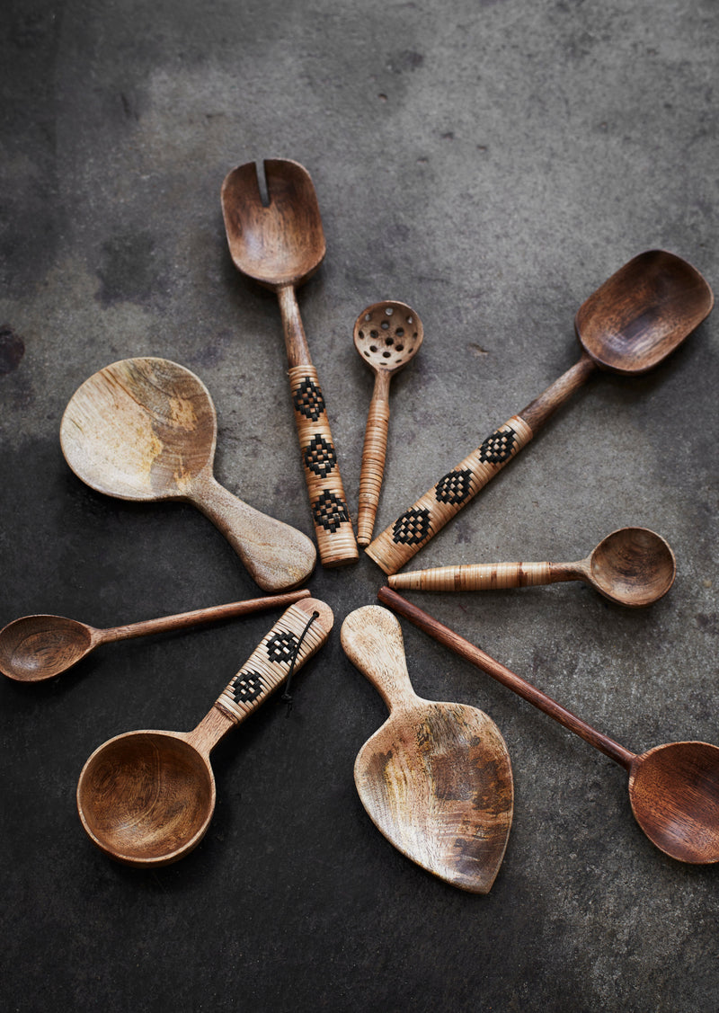hand-carved mango wood spoon with narrow handle
