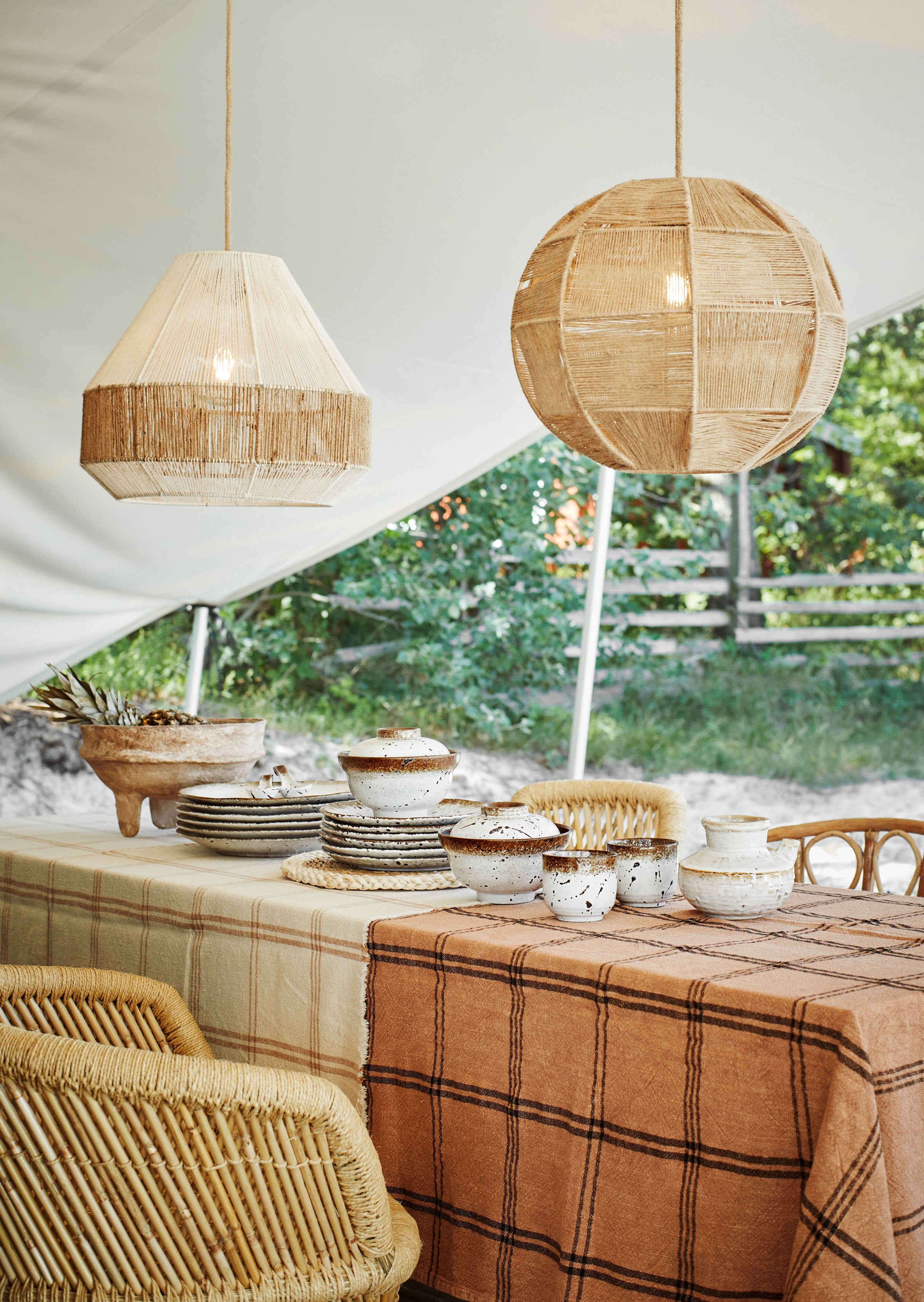 nordic brown rimmed and speckled beige dining crockery on a festive table