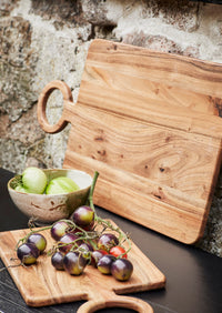 small white and green stoneware bowl in a relaxed Nordic setting with snacks
