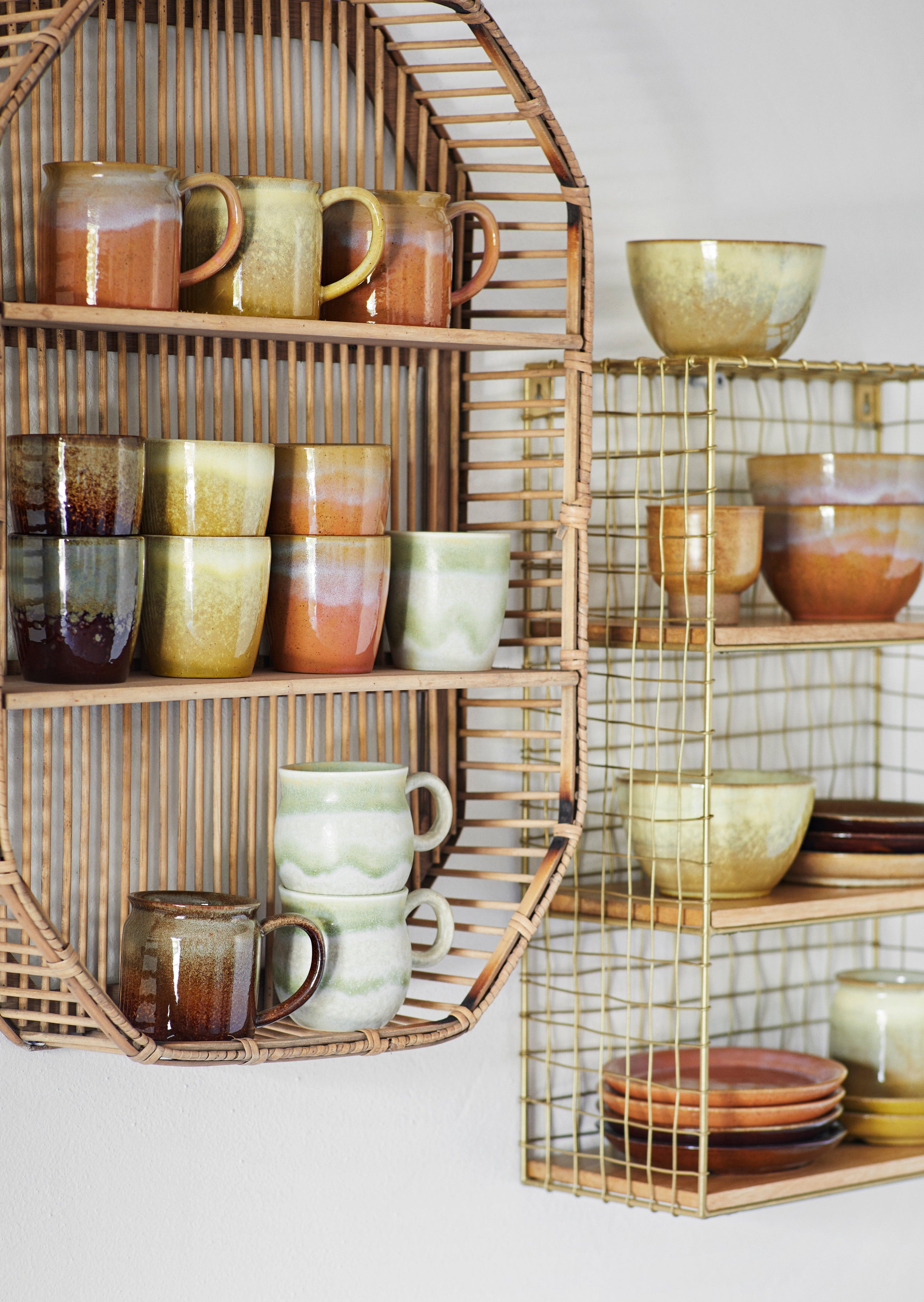 matching artisan tableware including lime green and peach mugs
