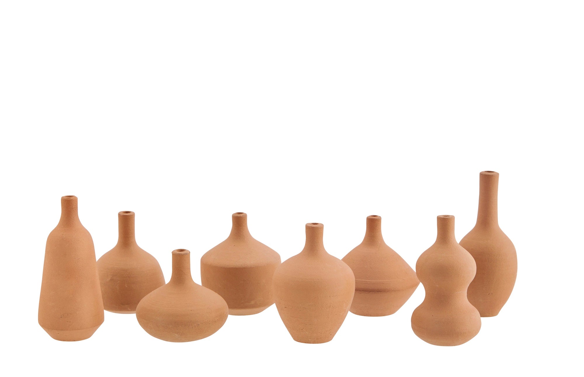 Set of small terracotta vase style incense holders on a white background