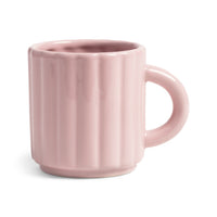 Light pink ribbed mug on a white background by &klevering