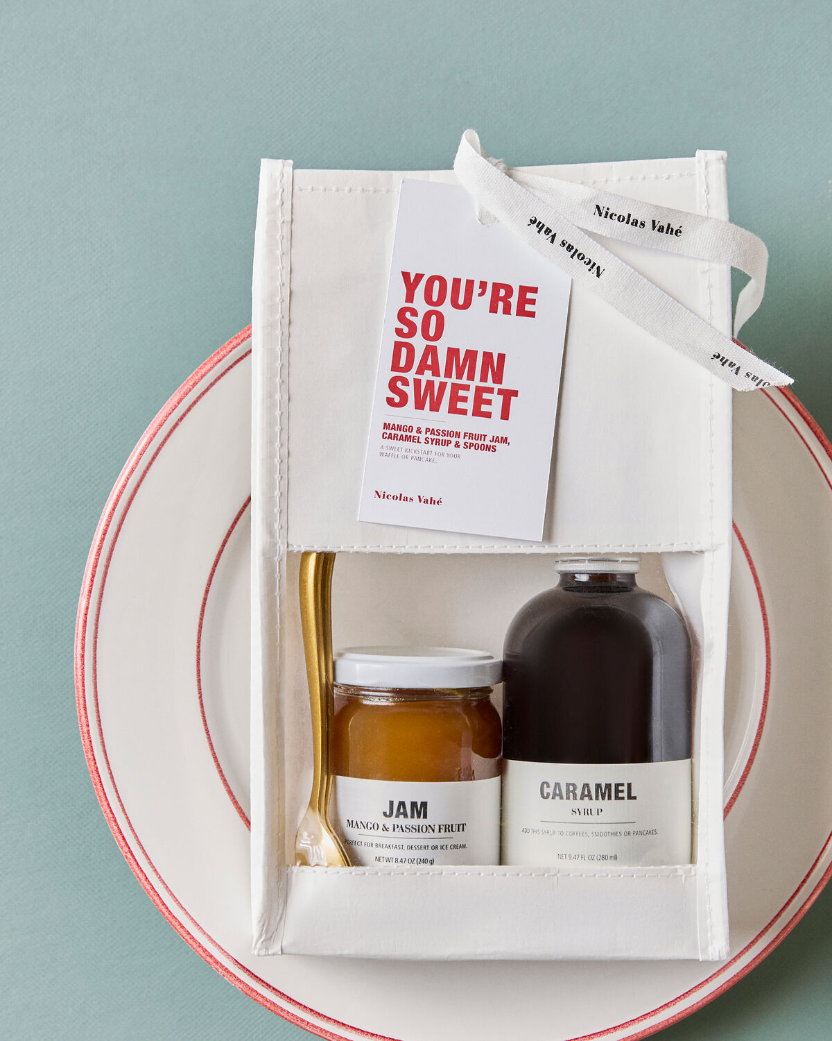 Nicolas Vahé You're So Damn Sweet gift bag on a cream plate with a red rim