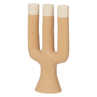 Close view of the speckled apricot finish and cream tips on the Nox candle holder