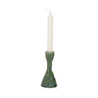 Oto green candle holder with an ivory dinner candle