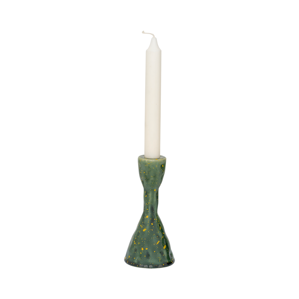 Oto green candle holder with an ivory dinner candle