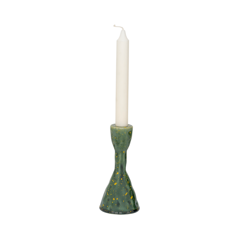 Oto green candle holder with an ivory dinner candle