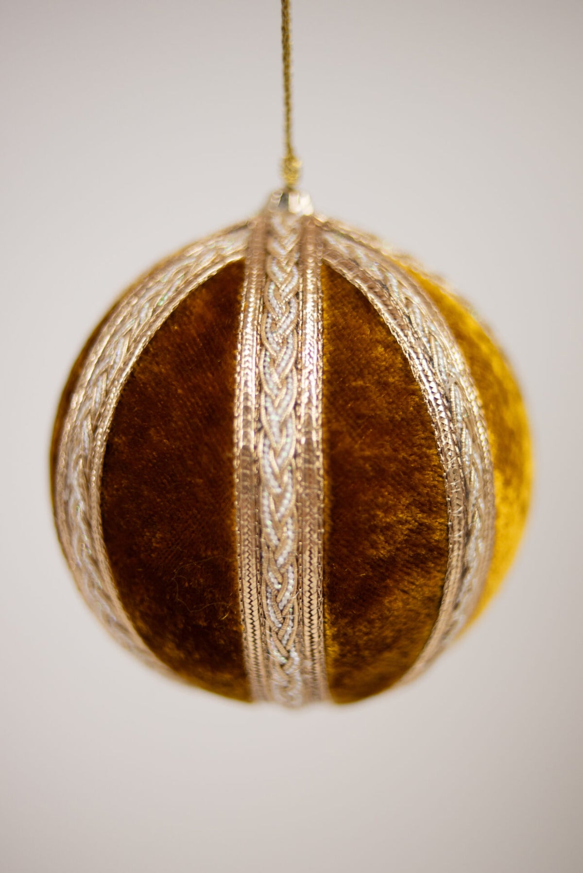 Close-up of the velvet panels and gold braid on the Palazzo bauble by Olsson & Jensen