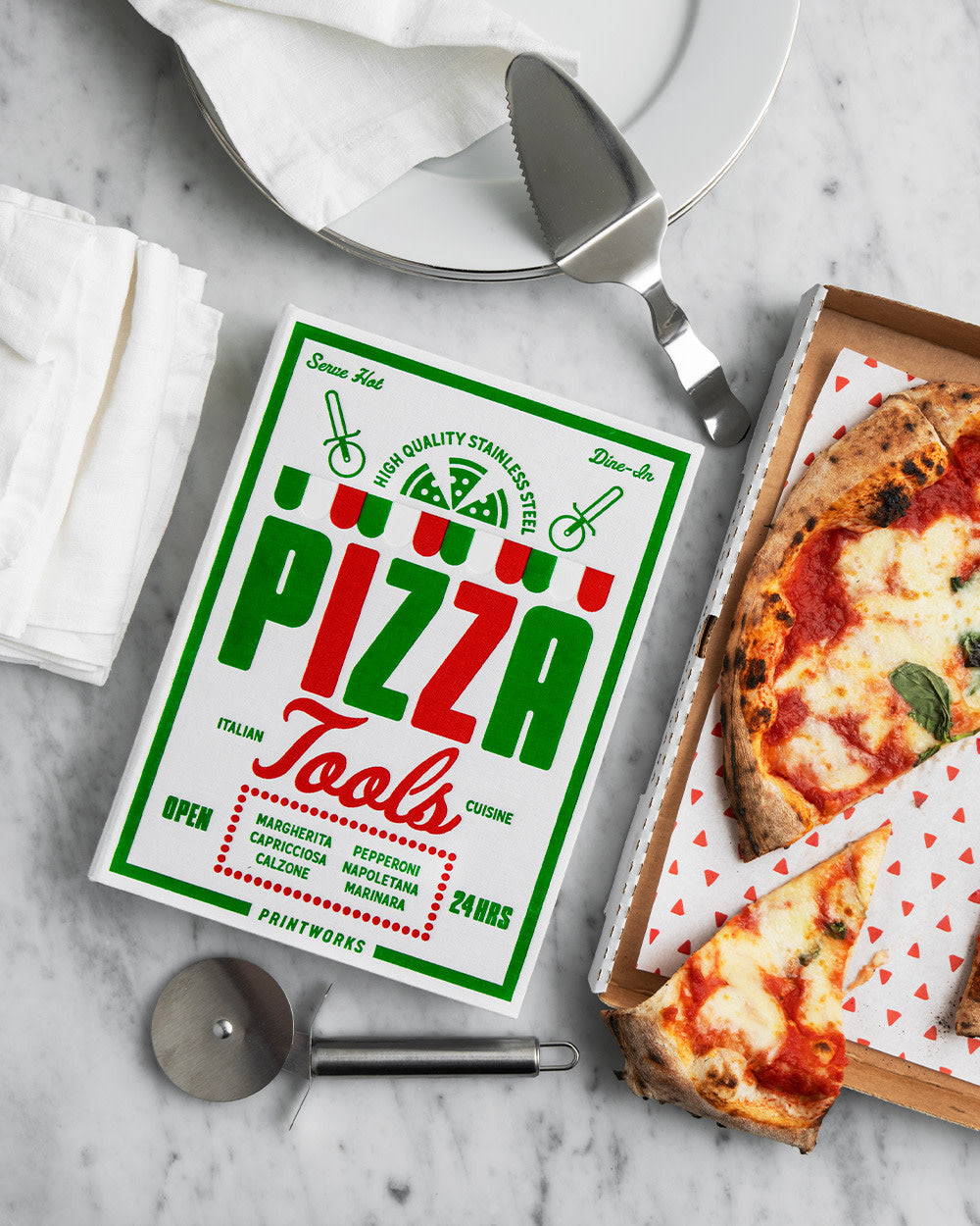 Pizza Tools kit styled with pizza and napkins