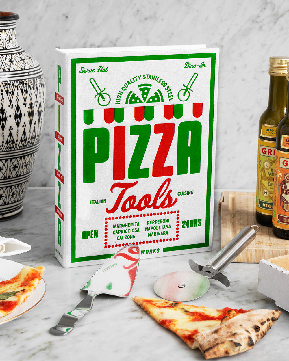 Pizza Tools box and utensils displayed with pizza