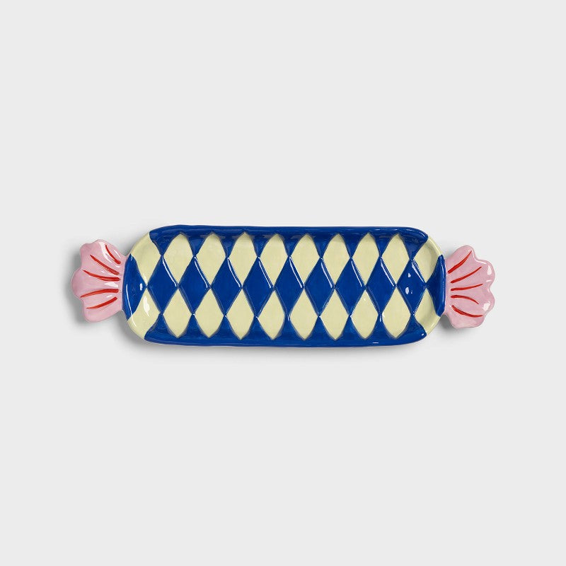  large candy-shaped ceramic plate in blue and cream diamond pattern
