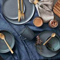 Northern Green mug styled with RAW tableware for layered Nordic dining