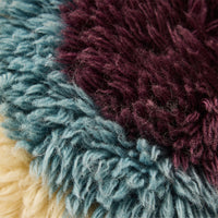 close up of fluffy HKLIVING cushion showing multicolour wool fibres and handcrafted texture
