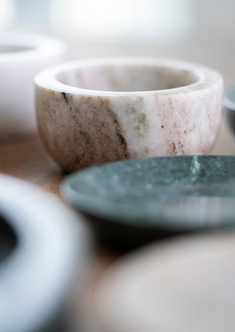 close-up of hand-carved green marble tray showing natural veining and polished finish
