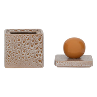 Runa storage jar with its lid off, beside the jar