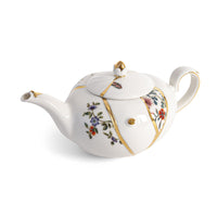 Seletti Kintsugi porcelain teapot with real gold seam detailing, cut-out side view
