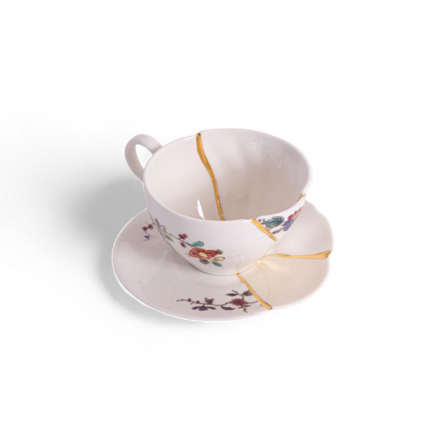 Kintsugi tea cup and saucer style 2 by Seletti showing gold repaired joins
