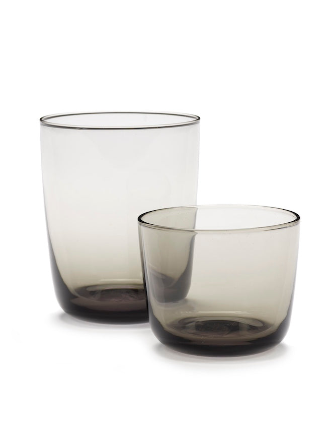 Two smoky grey Cena glasses by Serax