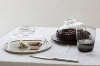 Serax Cena smoky grey glasses on a set dining table