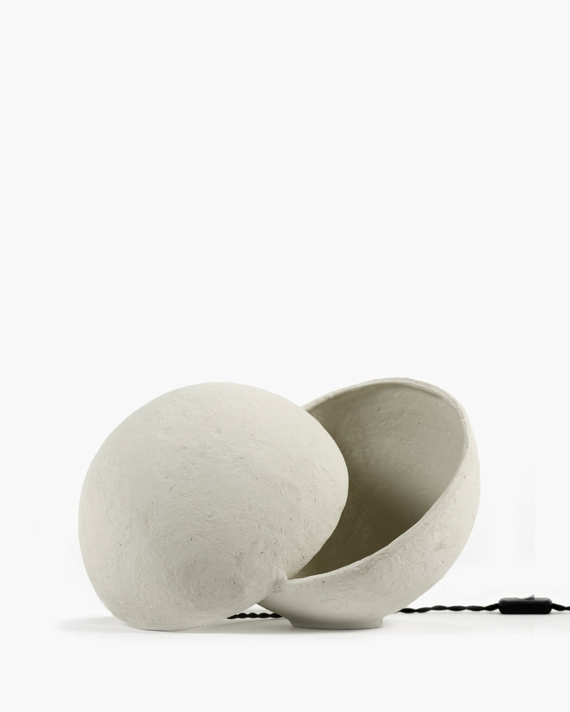 Earth paper mâché table lamp by Marie Michielssen for Serax, white split sphere on a white background